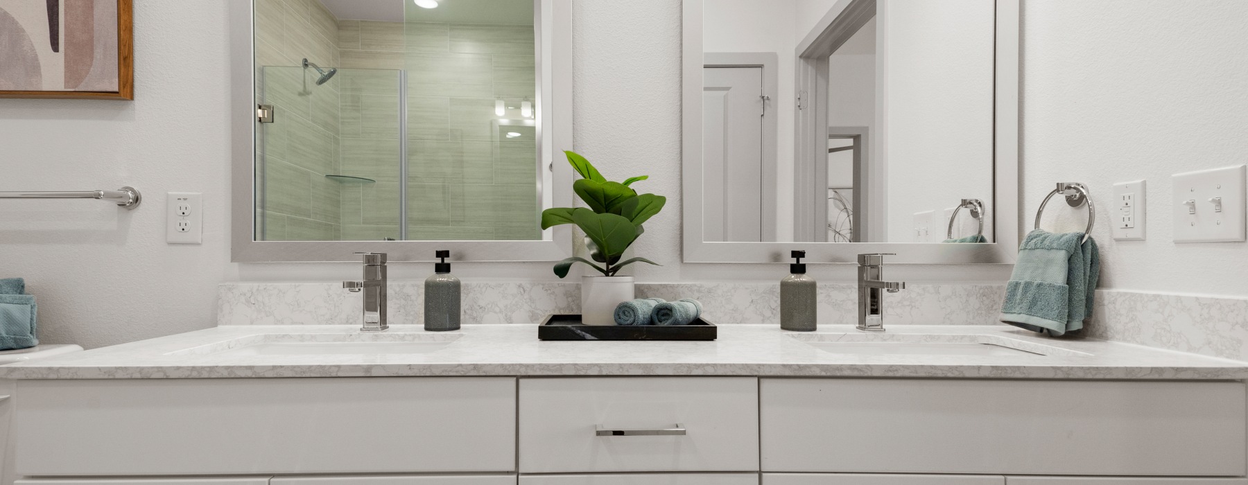 Bathroom with white cabinets and bright quartz countertops