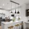a kitchen with a bar stool and a bar stool