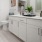 a bathroom with white cabinets