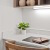 a kitchen with a table and a book on it