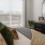 a bedroom with a bed and a fan
