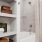 a bathroom with a tub and shelves