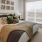 a bedroom with a fan and a bed