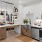 a kitchen with white cabinets